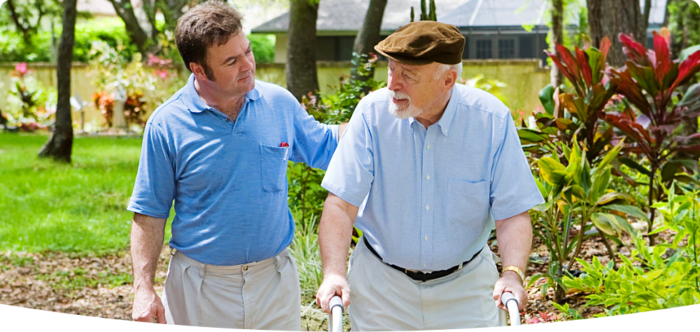 caregiver assissting patient on walking
